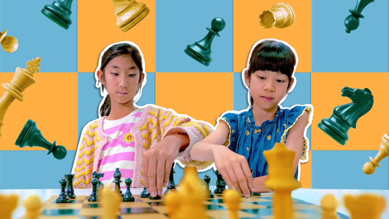 A stylised image of two young girls playing chess at the centre, with a chessboard and chess pieces flying in the background.