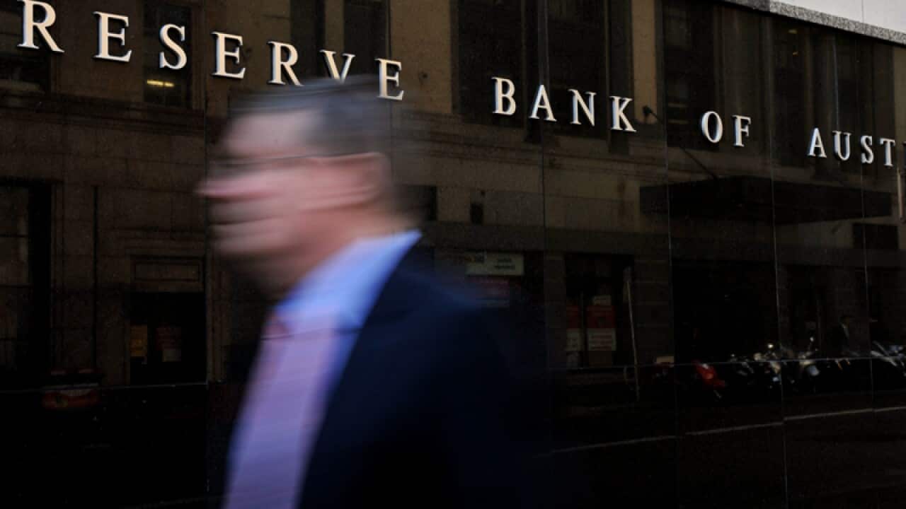 A man walks past the RBA.