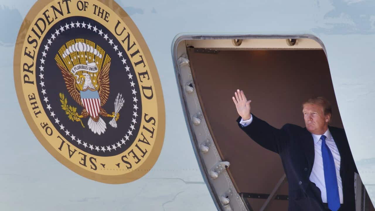 Donald Trump waves as he boards Air Force One, Monday, Feb. 25, 2019.