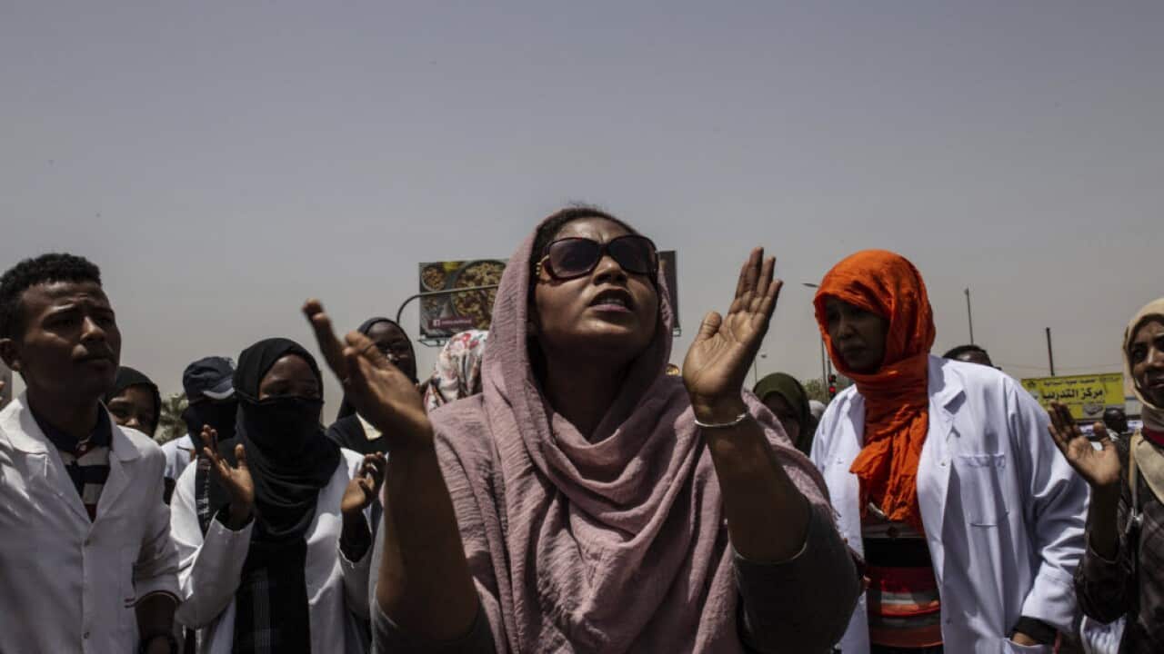 A group of protesters from the Sudanese medical profession syndicate march chant against military rule