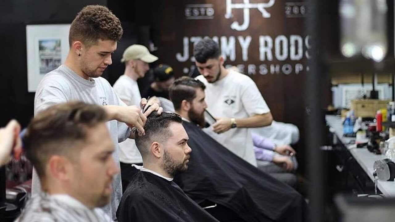 Men getting their hair cut at Jimmy Rod's Barber Shop
