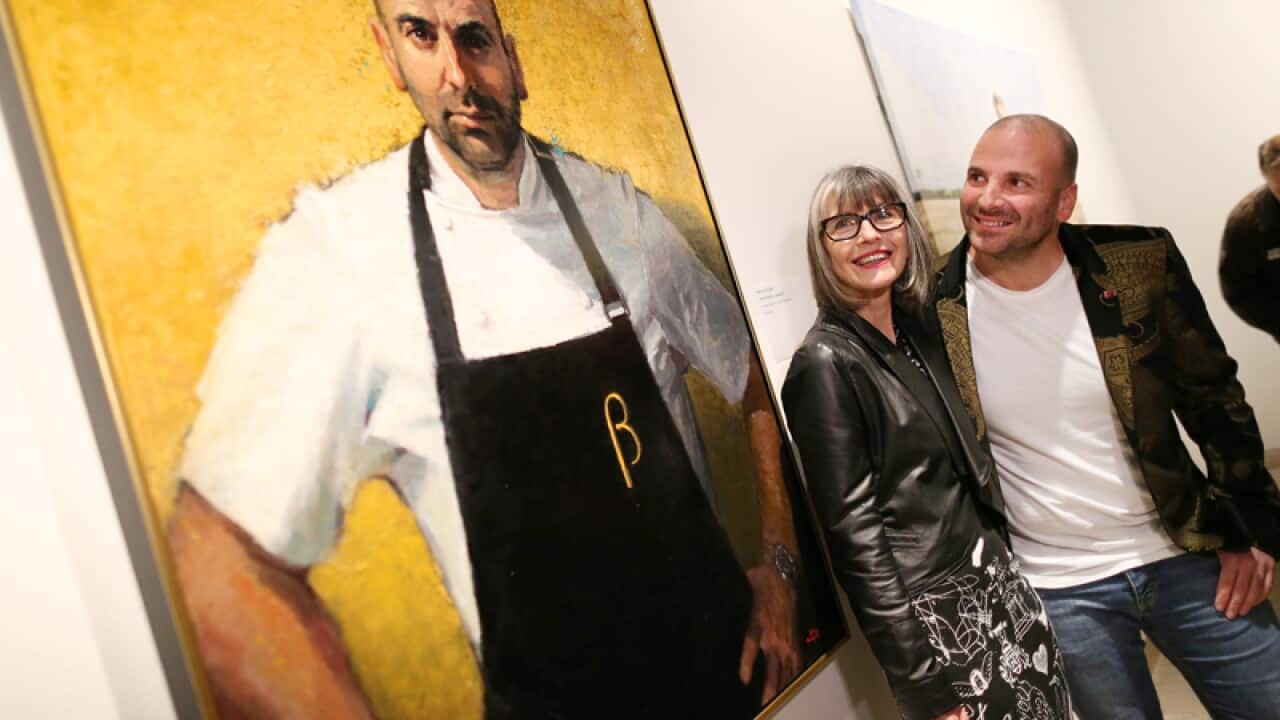 Betina Fauvel-Ogden and chef George Calombaris next to his portrait