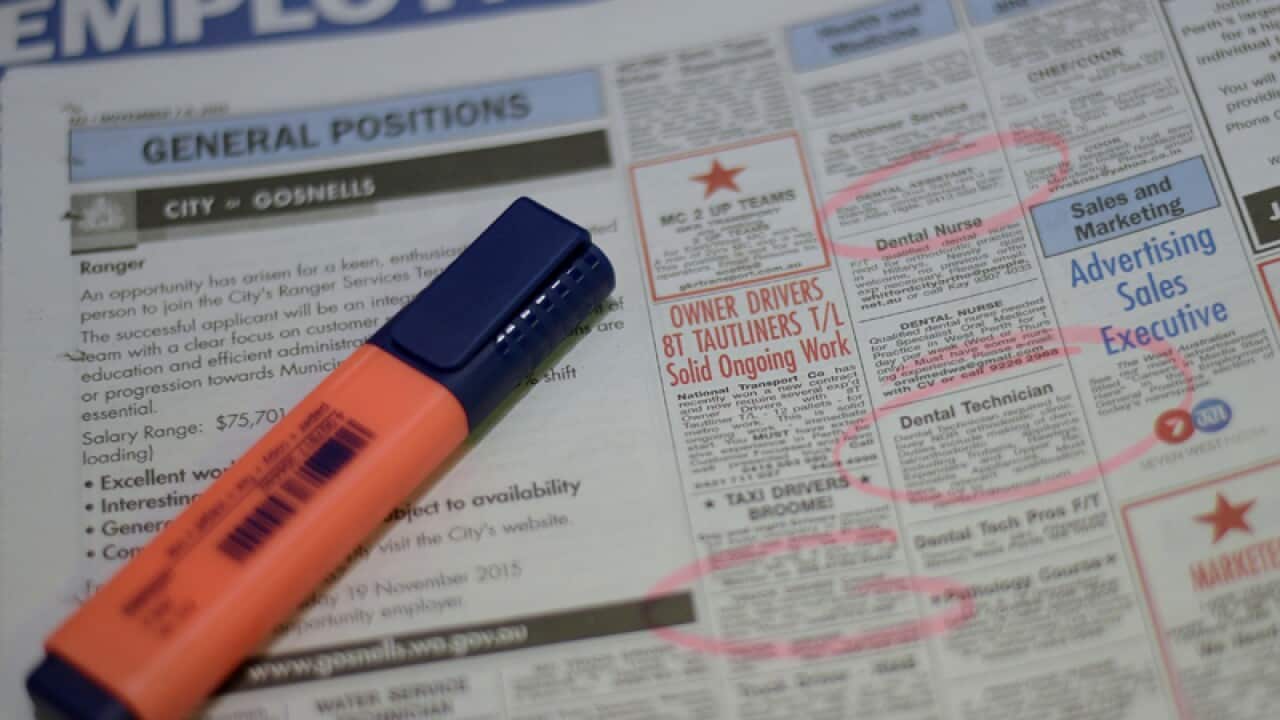 Job adverts are seen in a weekend newpaper