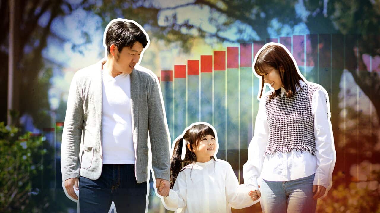 An image of parents and a child with the backdrop of a graph