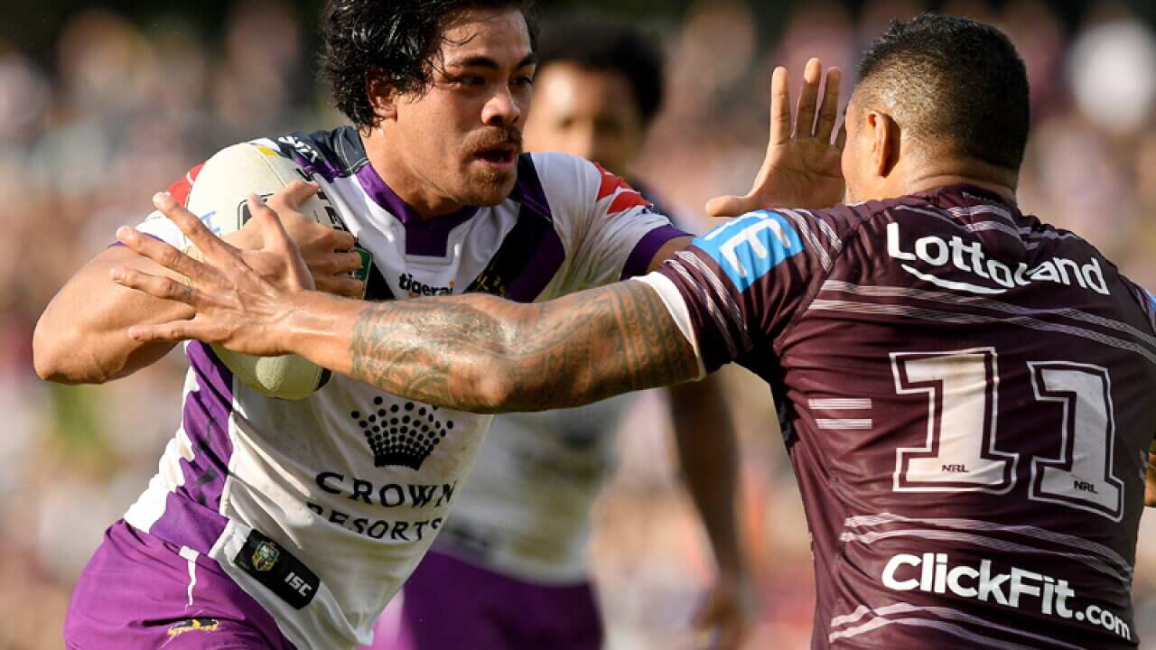 Young TonumaipeÕa of the Storm fends off a tackle