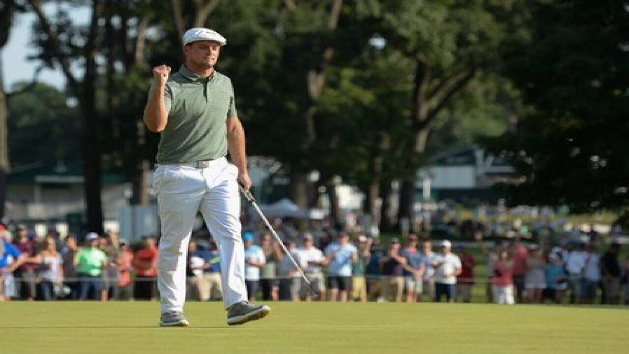 Golf-DeChambeau delighted after charging to a four-stroke lead