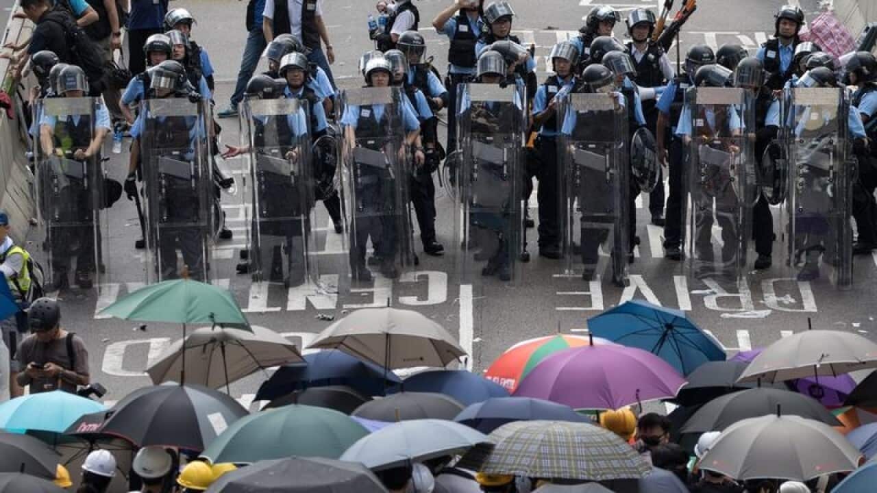 Students and people stage a showdown with Hong Kong police