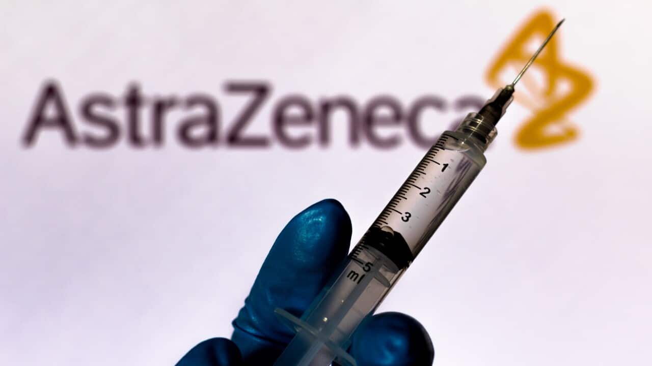 Medical syringe with AstraZeneca company logo displayed