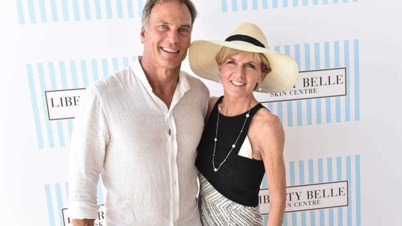David Panton (L) and Minister for Foreign Affairs Julie Bishop pose for photos in the Liberty Belle marquee at Portsea Polo in Melbourne, Saturday, Jan. 9, 2016. (AAP Image/Julian Smith) NO ARCHIVING