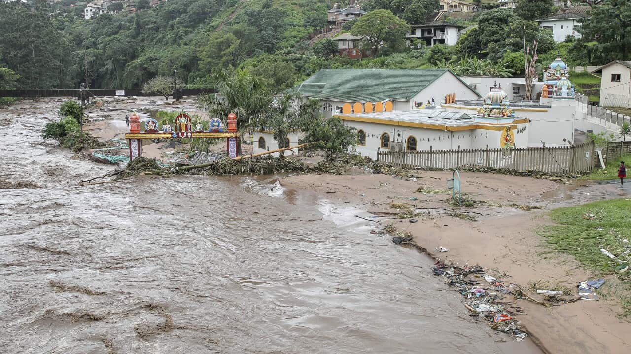 Floodwaters wash through properties near Durban in South Africa.