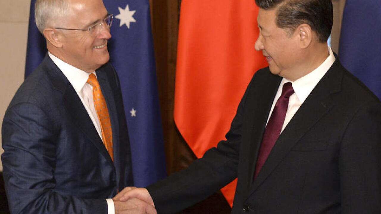 Australian Prime Minister Malcolm Turnbull, left, and Chinese President Xi Jinping shake hands before the meeting at the Diaoyutai State Guesthouse in Beijing Friday, April 15, 2016 (Kenzaburo Fukuhara/Pool Photo via AP)