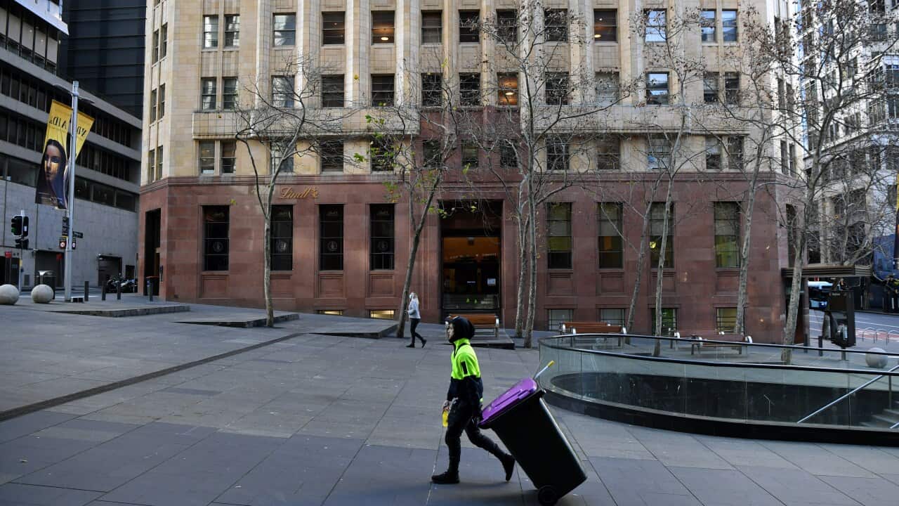 A cleaner at work in Martin Place in the central business district in Sydney.