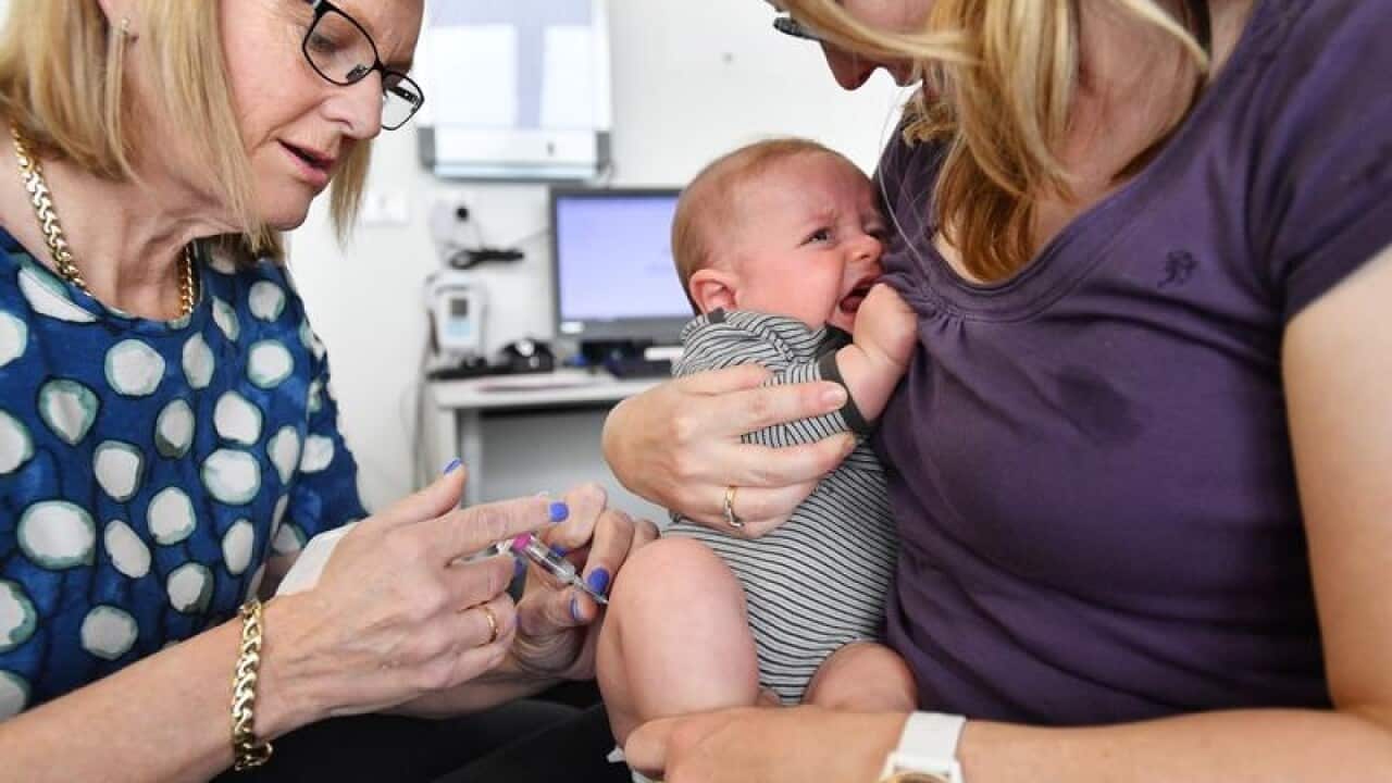 A baby gets an injection