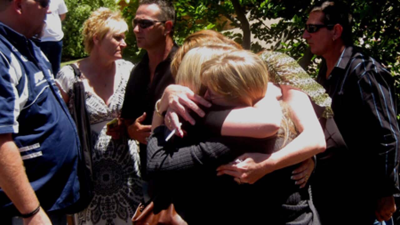 kapunda_relatives_hug_101126_B_aap_55693860