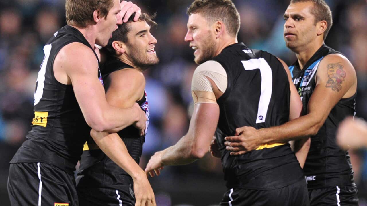 Port Adelaide's Chad Wingard (2nd from L) celebrates goal