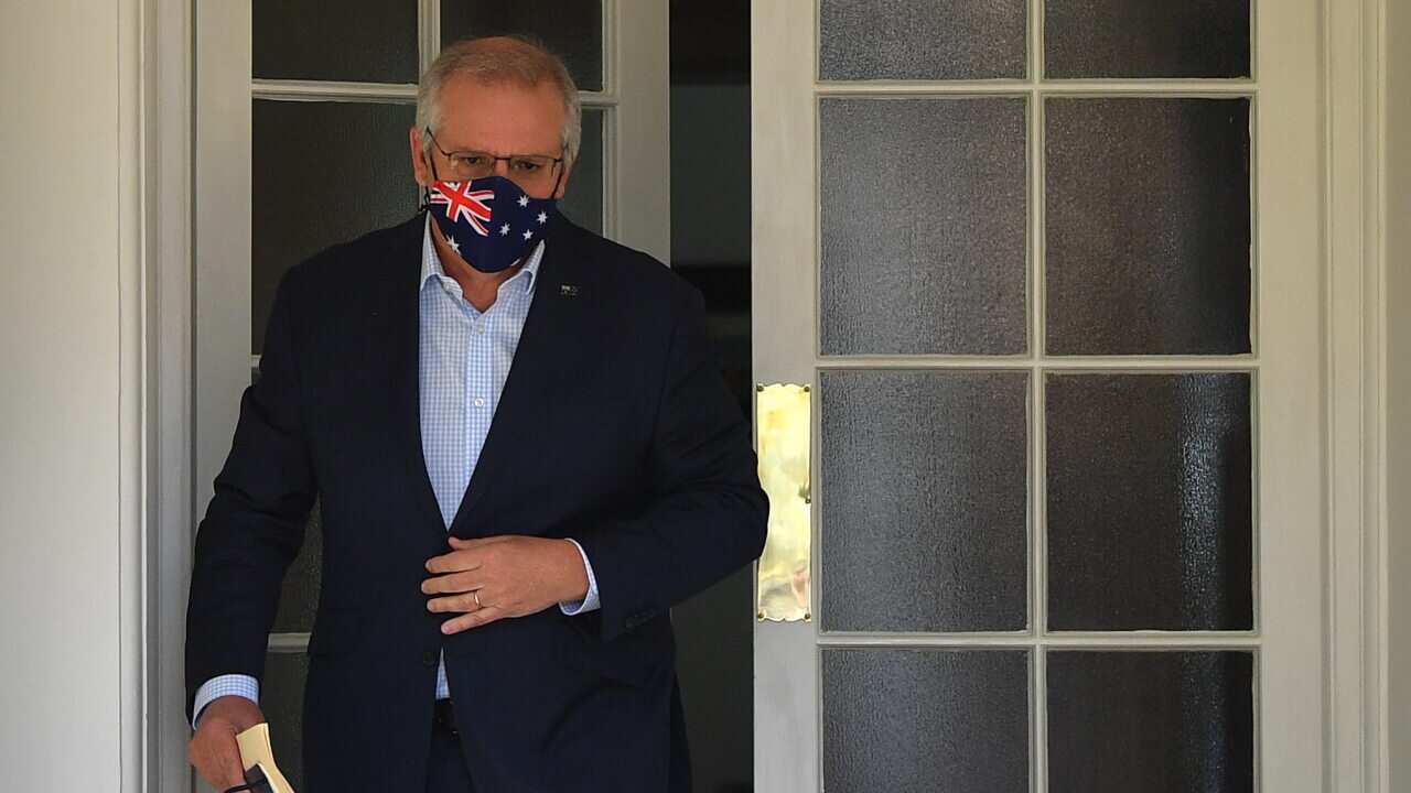 Australian Prime Minister Scott Morrison arrives to speak to media during a press conference at Kirribilli House in Sydney on Sunday.