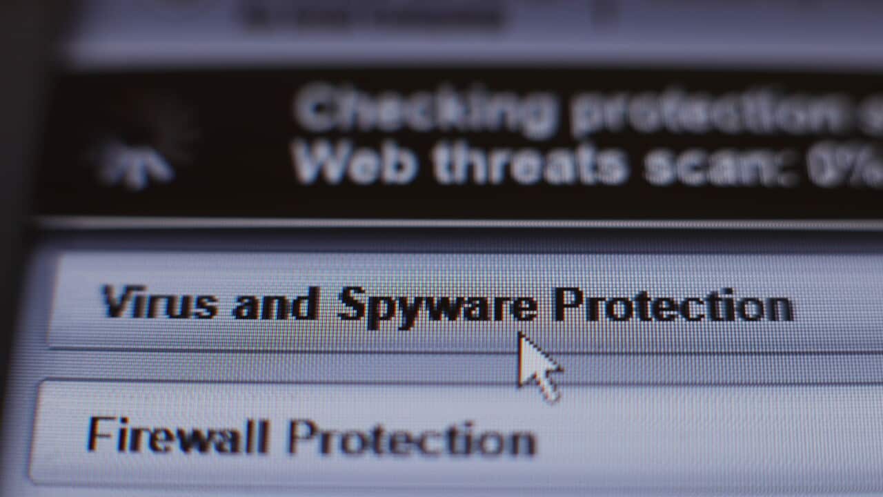Internet security software performing an anti-virus and anti-spyware scan on a laptop.