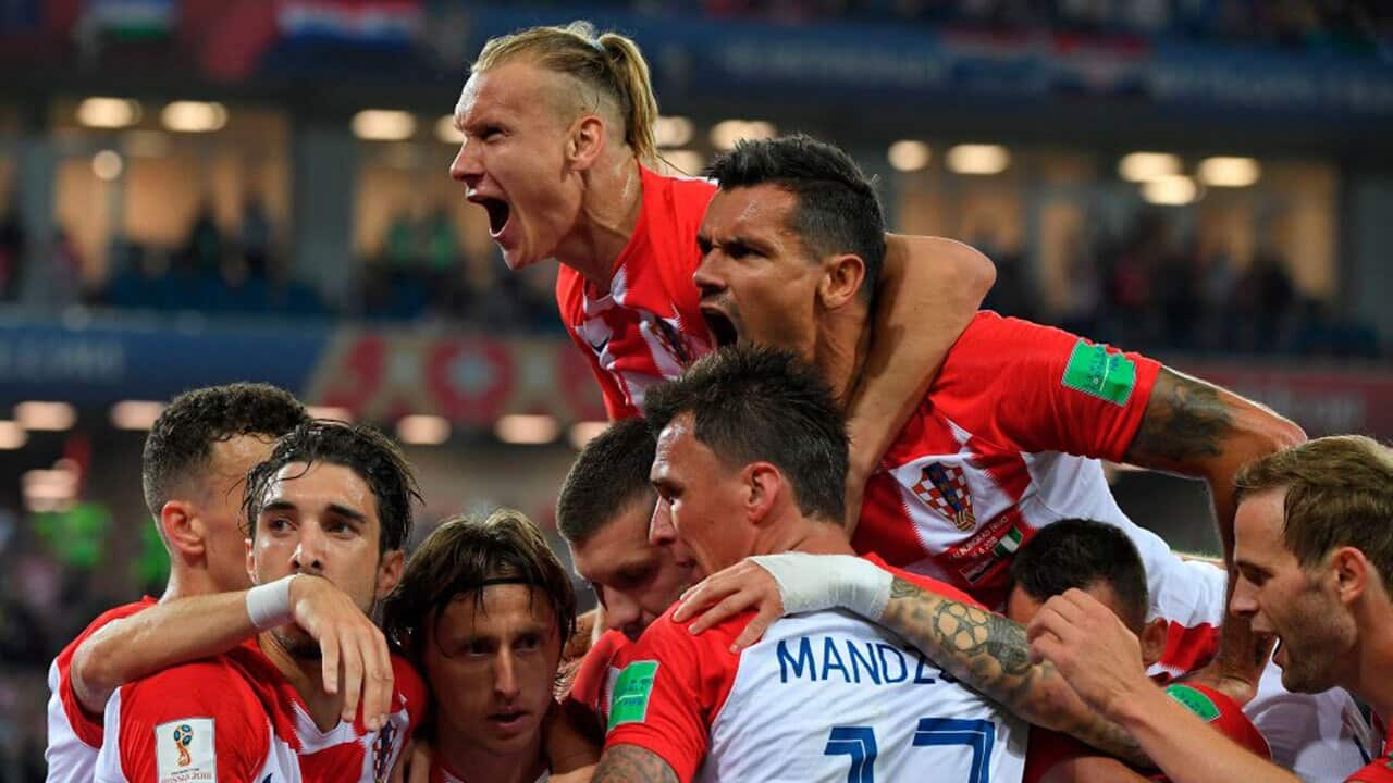 Croatia's midfielder Luka Modric (3rd L) celebrates scoring a penalty with his teammates during the Russia 2018 World Cup match between Croatia and Nigeria.
