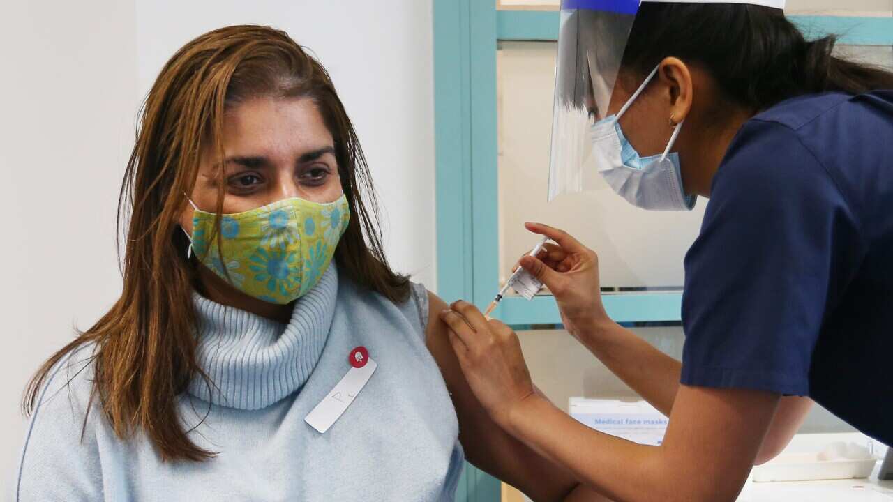 A nurse administers the Pfizer vaccine to a client at the St Vincent's COVID-19 Vaccination Clinic in Sydney on 1 July, 2021.