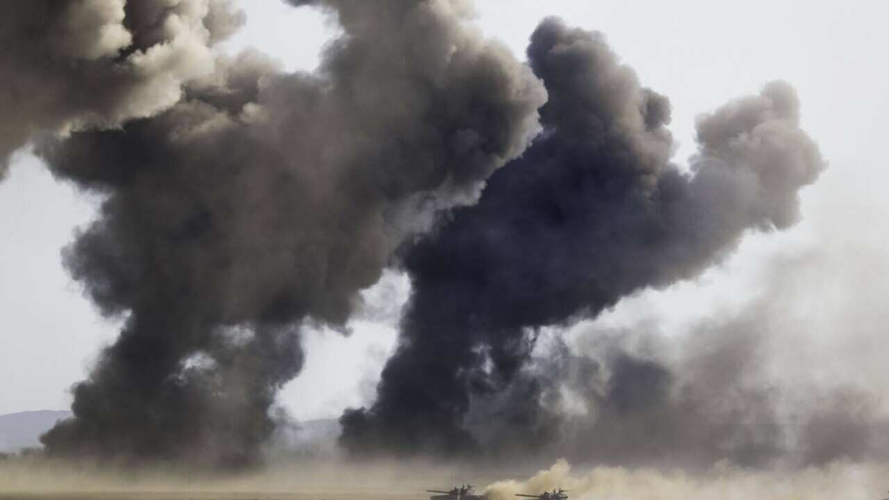Russian army tanks during military drills at the Black Sea coast, Crimea, Friday, Sept. 9, 2016