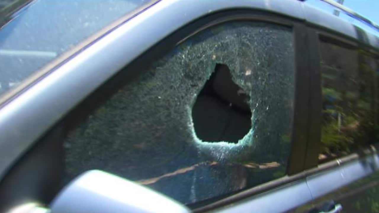 Police smashed a car window to rescue a boy locked inside.