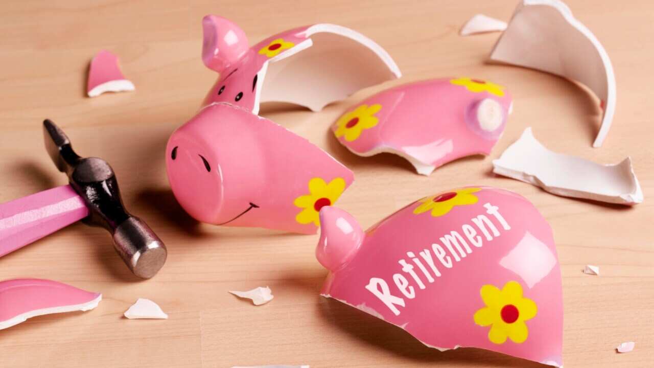 Smashed piggy bank with "retirement" written on