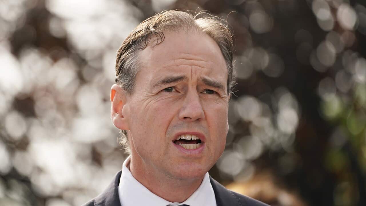 Australian Health Minister Greg Hunt speaks to the media