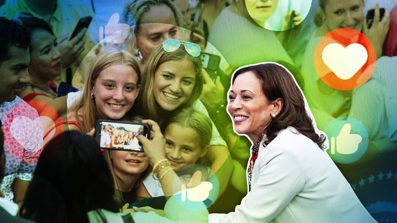 A graphic showing Kamala Harris taking a photo alongside several young girls. All are smiling. There are superimposed "like" and "heart" reaction emojis.