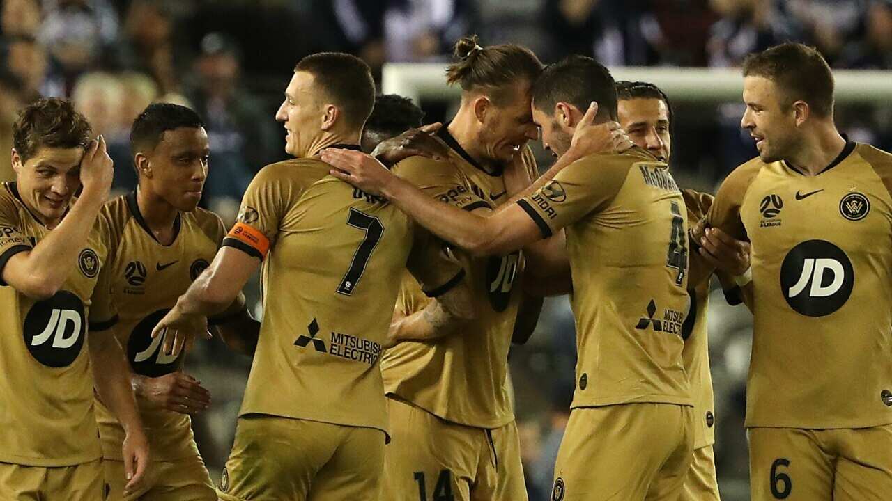 Western Sydney players celebrate their 2nd goal against Victory.