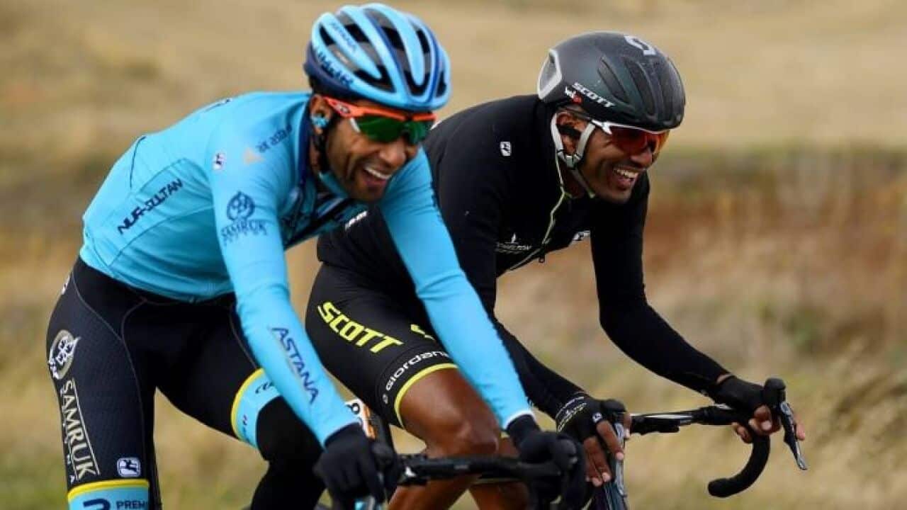 Eritrean and Ethiopian cyclists chatting while competing at Vuelta.