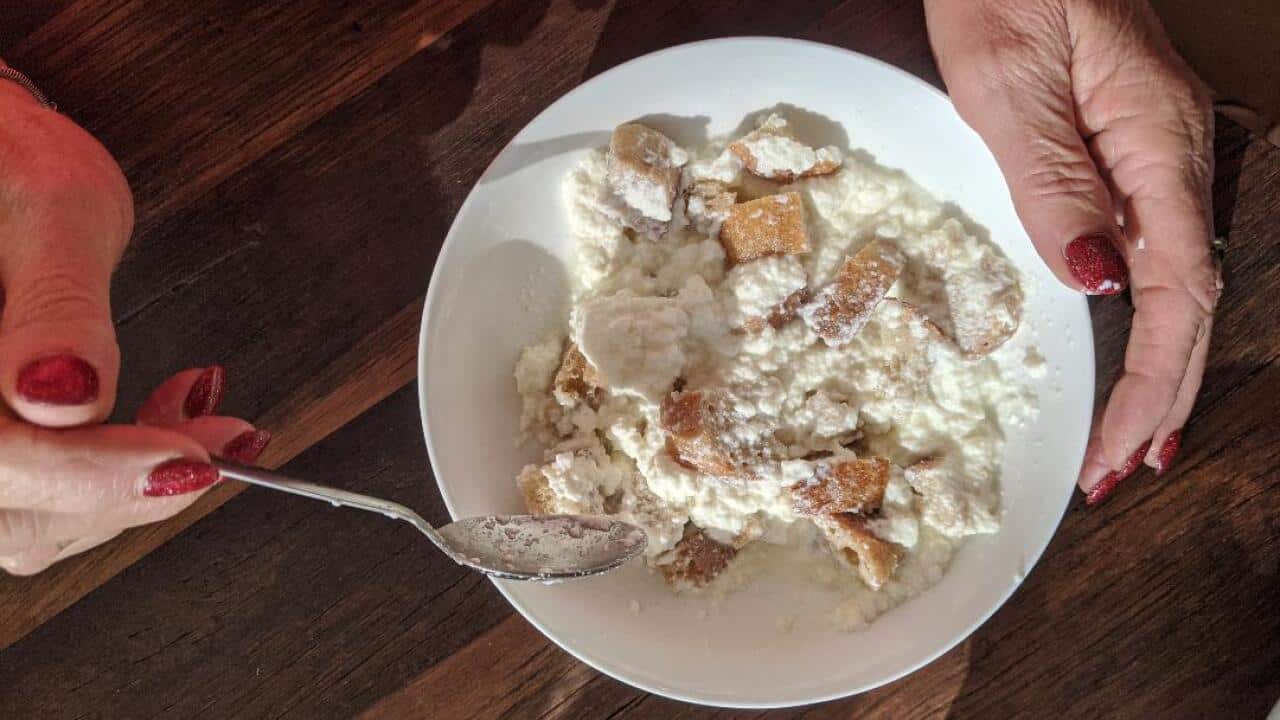 Hot ricotta in a bowl with crusty bread