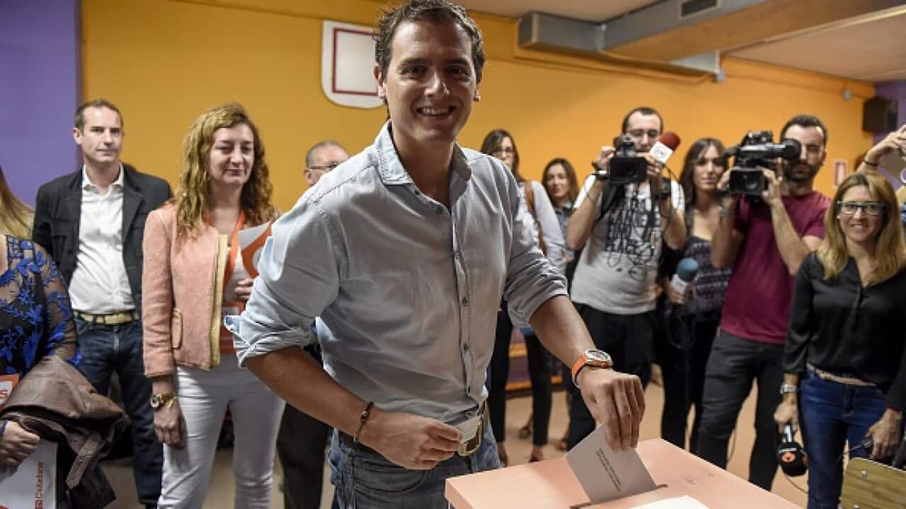 Leader of Ciudadanos (Citizens) political party Albert Ribera casts his ballot for the regional election at a polling station in Barcelona. (Getty)
