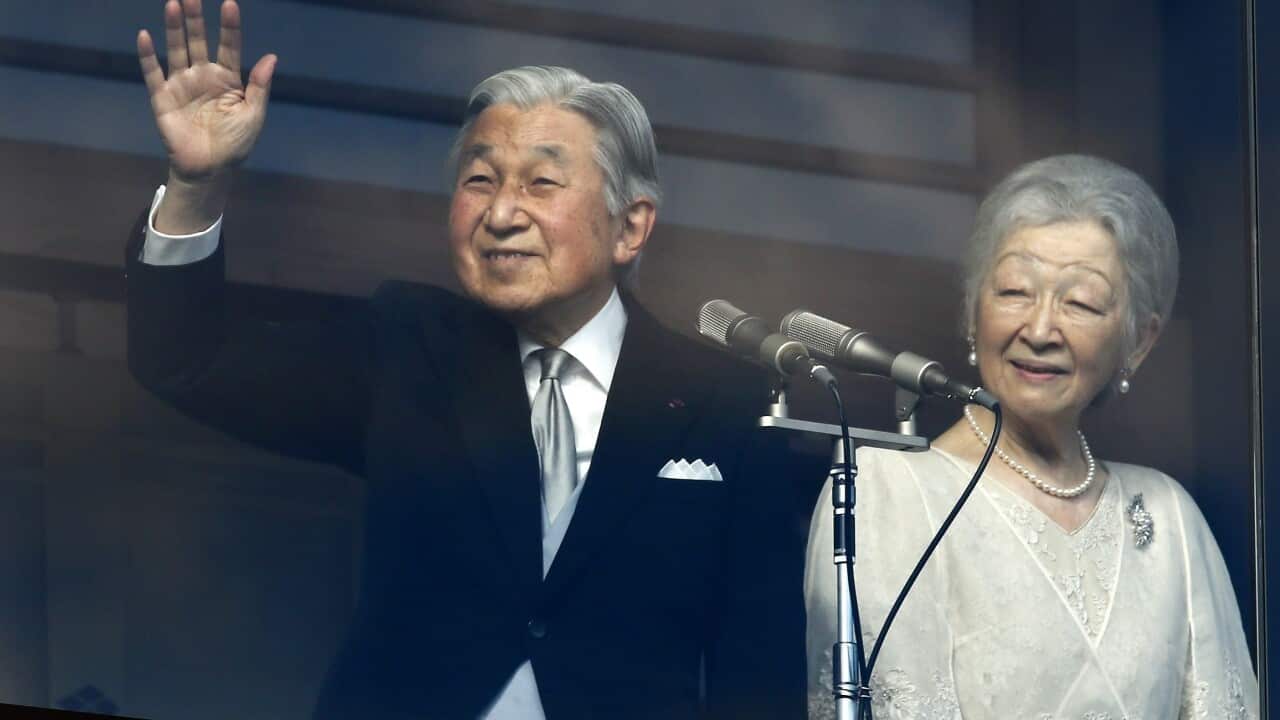 Japan's Emperor Akihito (L), accompanied by Empress Michiko (R)