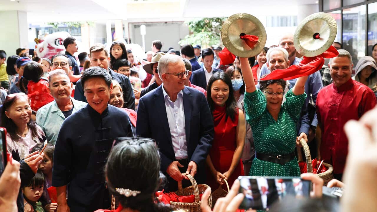 Anthony Albanese and Sally Sitou standing in a crowd celebrating Lunar New Year