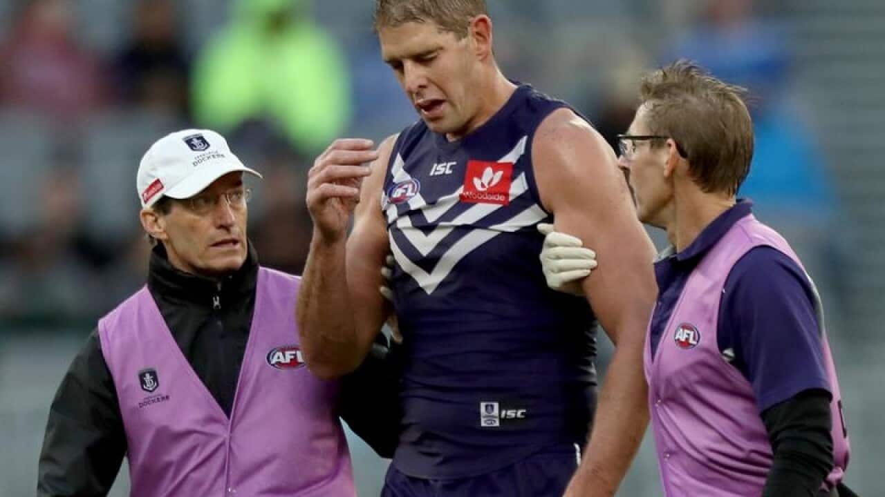 Fremantle Dockers player Aaron Sandilands leaves the field