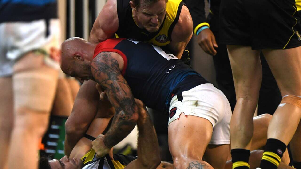 Trent Cotchin, Jack Riewoldt and Nathan Jones fight