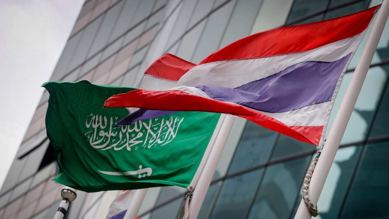 Saudi flag besides Thai flag