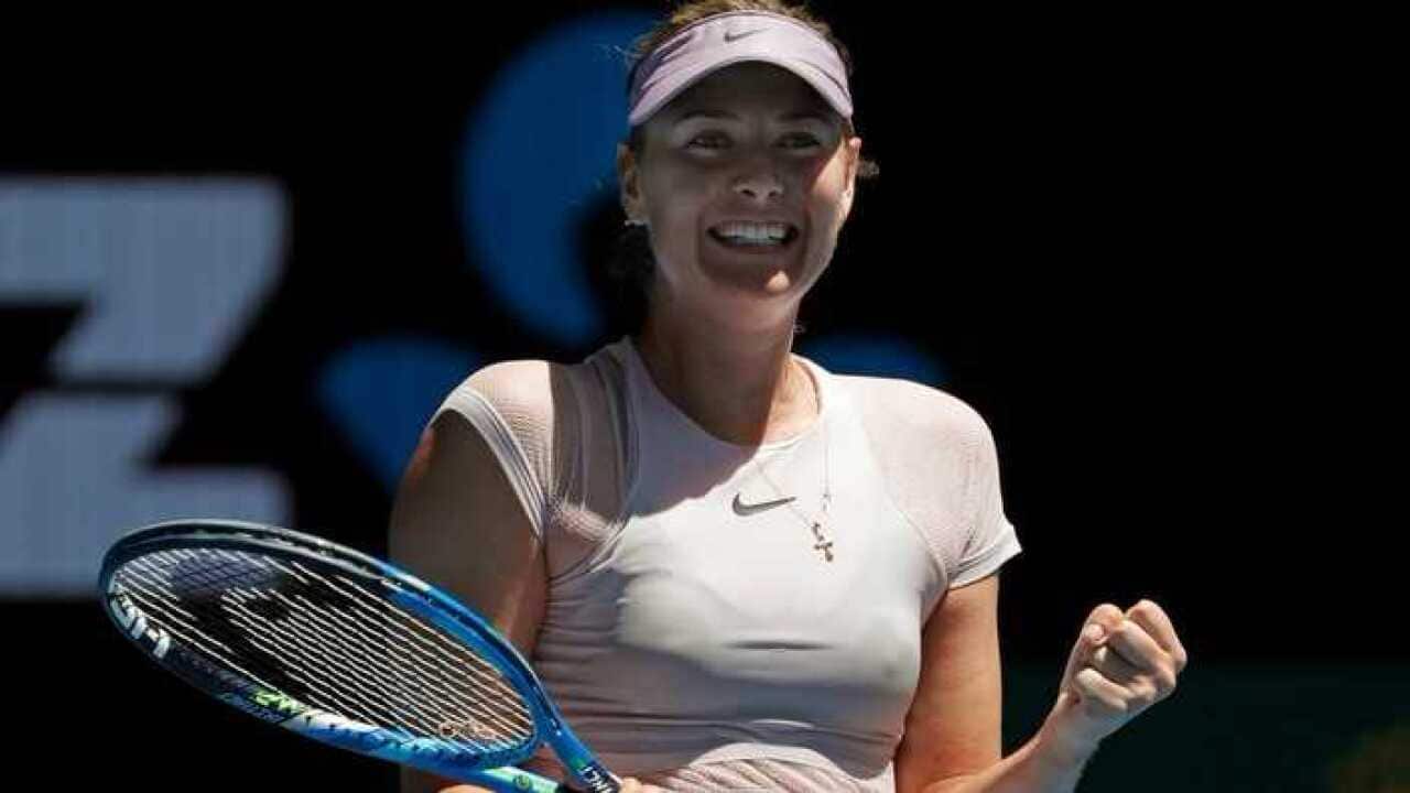 Russia's Maria Sharapova celebrates after she won over Germany's Tatjana Maria during their first round match at the Australian Open tennis championships in Melbourne, Australia, Tuesday, Jan. 16, 2018.