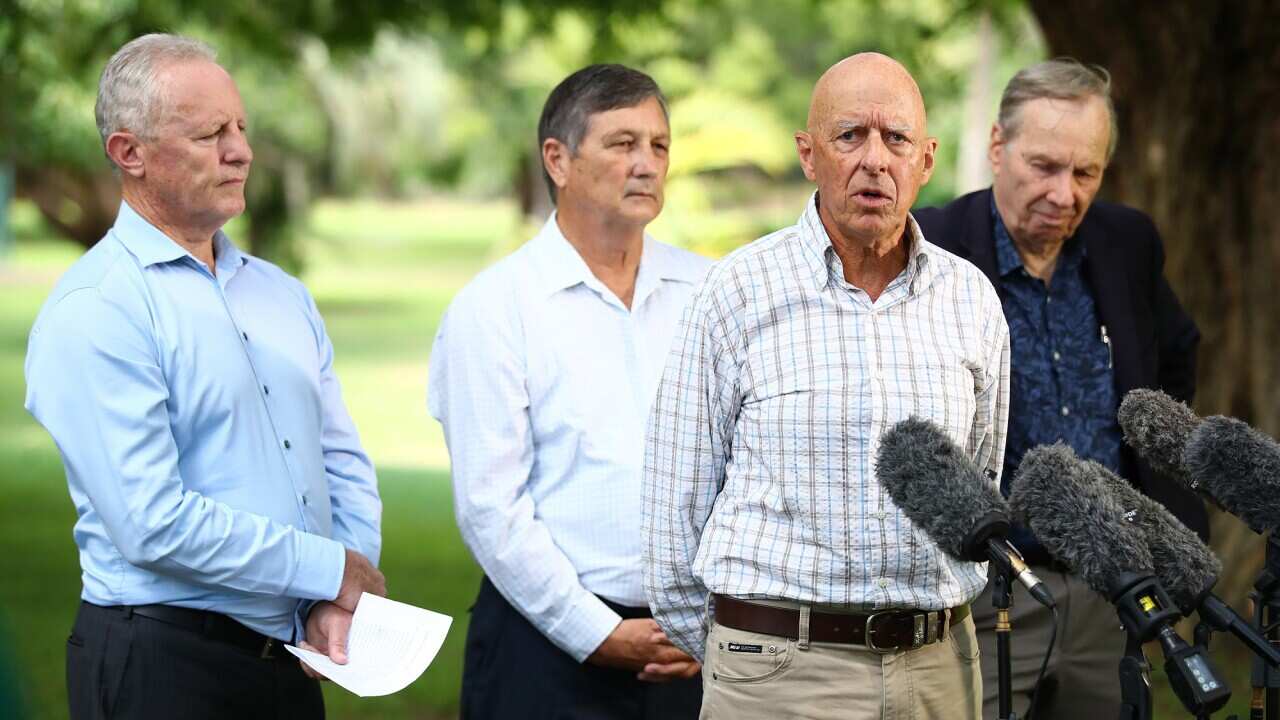 Former emergency services leaders Major General Peter Dunn, Greg Mullins, Lee Johnson and Chas Keys in Brisbane on 14 March 2022.