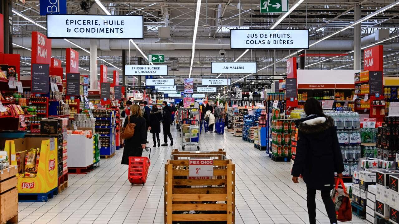 Consumers shop at Carrefour supermarket in Langueux, western France