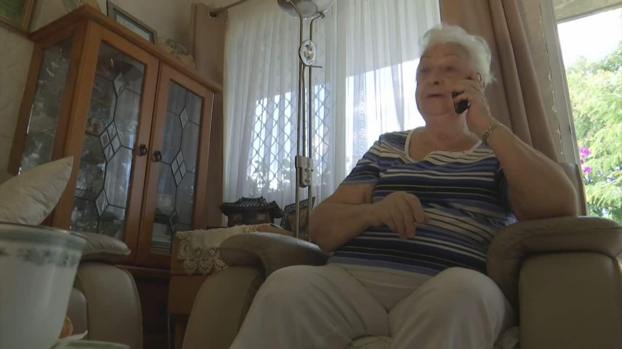 An elderly person receiving a phone call in the 'I speak your language' trial.