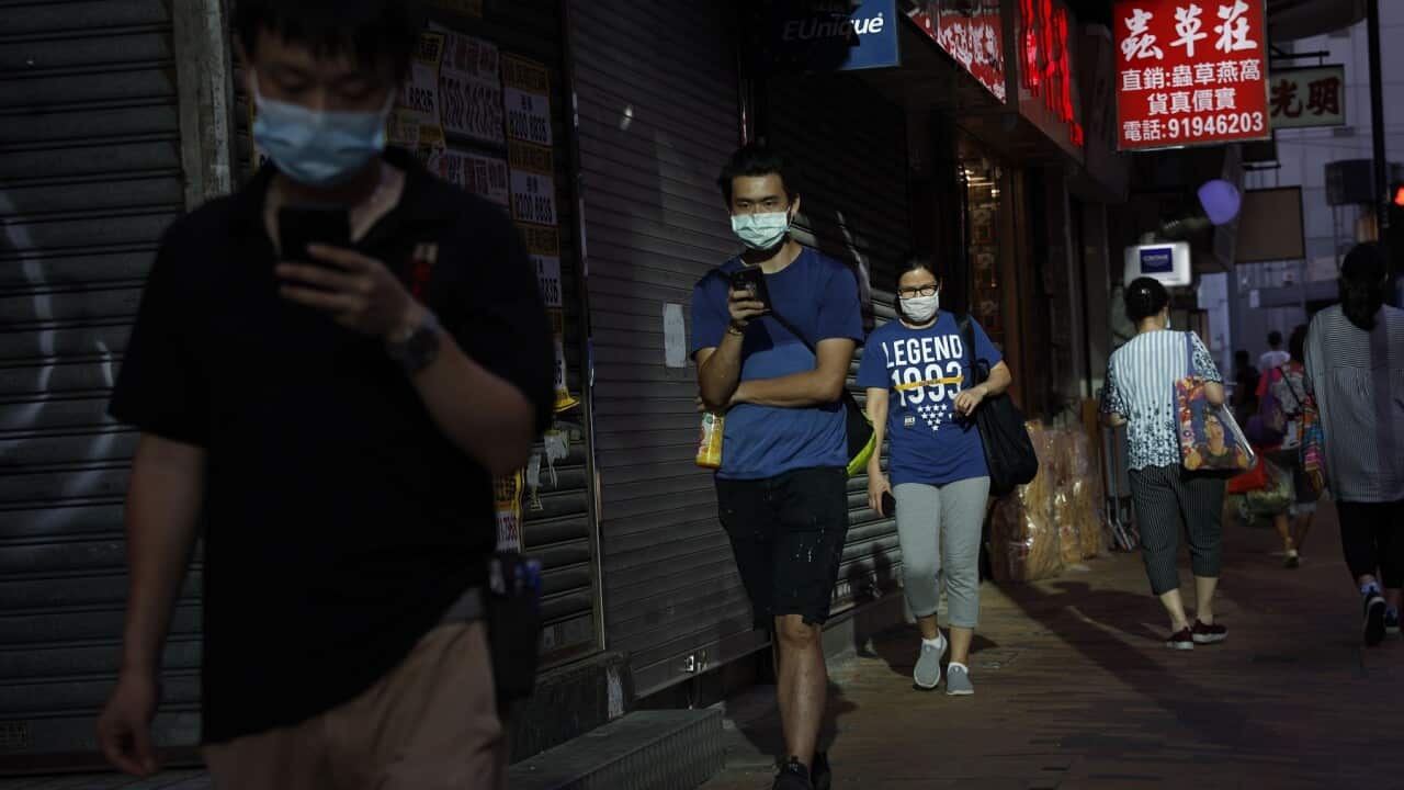 People in Hong Kong walking along the street