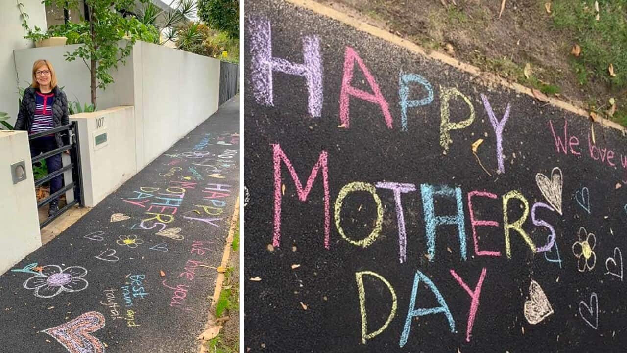Iman Allaf stands next to her decorated sidewalk