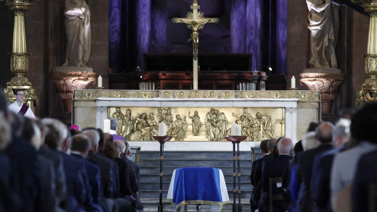 Guests attend late French president Jacques Chirac's funeral service at the Saint Sulpice church in Paris.