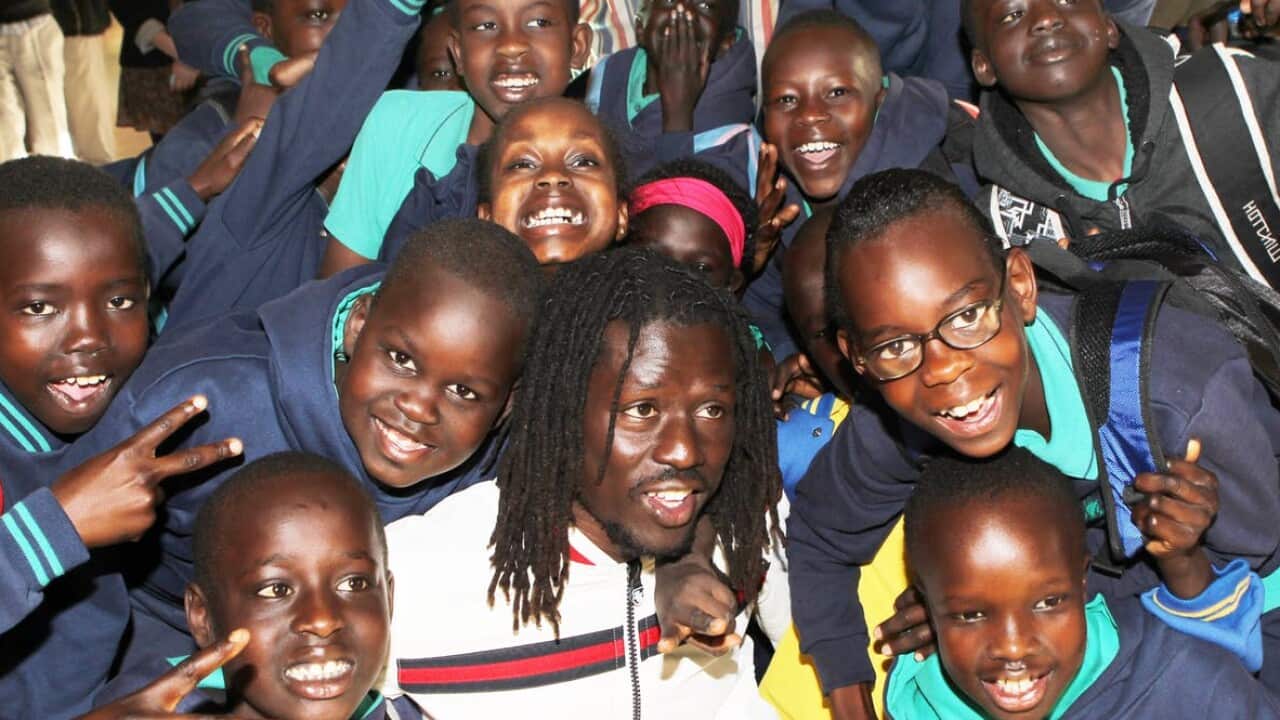 Hip hop star Emmanuel Jal, a former child soldier for the Sudanese People’s Liberation Army, visiting Sudanese school children in a Fitzroy community centre.