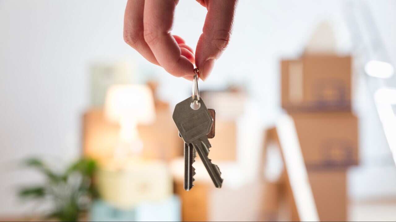 Keys in someone's hand in a newly bought house