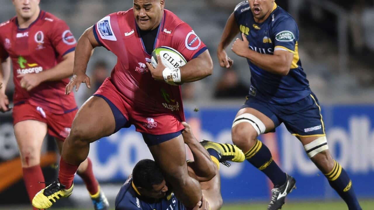 Scott Sio of the Brumbies tackles Taniela Tupou of the Reds