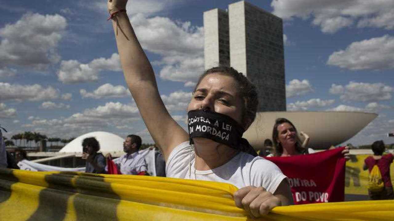 Supporters of Brazil's suspended President Dilma Rousseff shout slogans next to the National Congress, where the impeachment trial of Rousseff is taking place