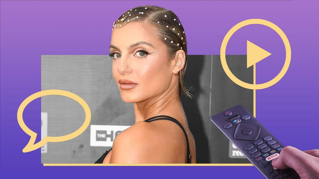 A picture of Domenica Calarco, a woman with short hair dotted with pearl accessories, looking over her shoulder. The picture is overlayed on a purple and blue gradient background, with a yellow 'play' icon and a yellow speech bubble. In the right corner is a picture of a hand pointing a remote at her.