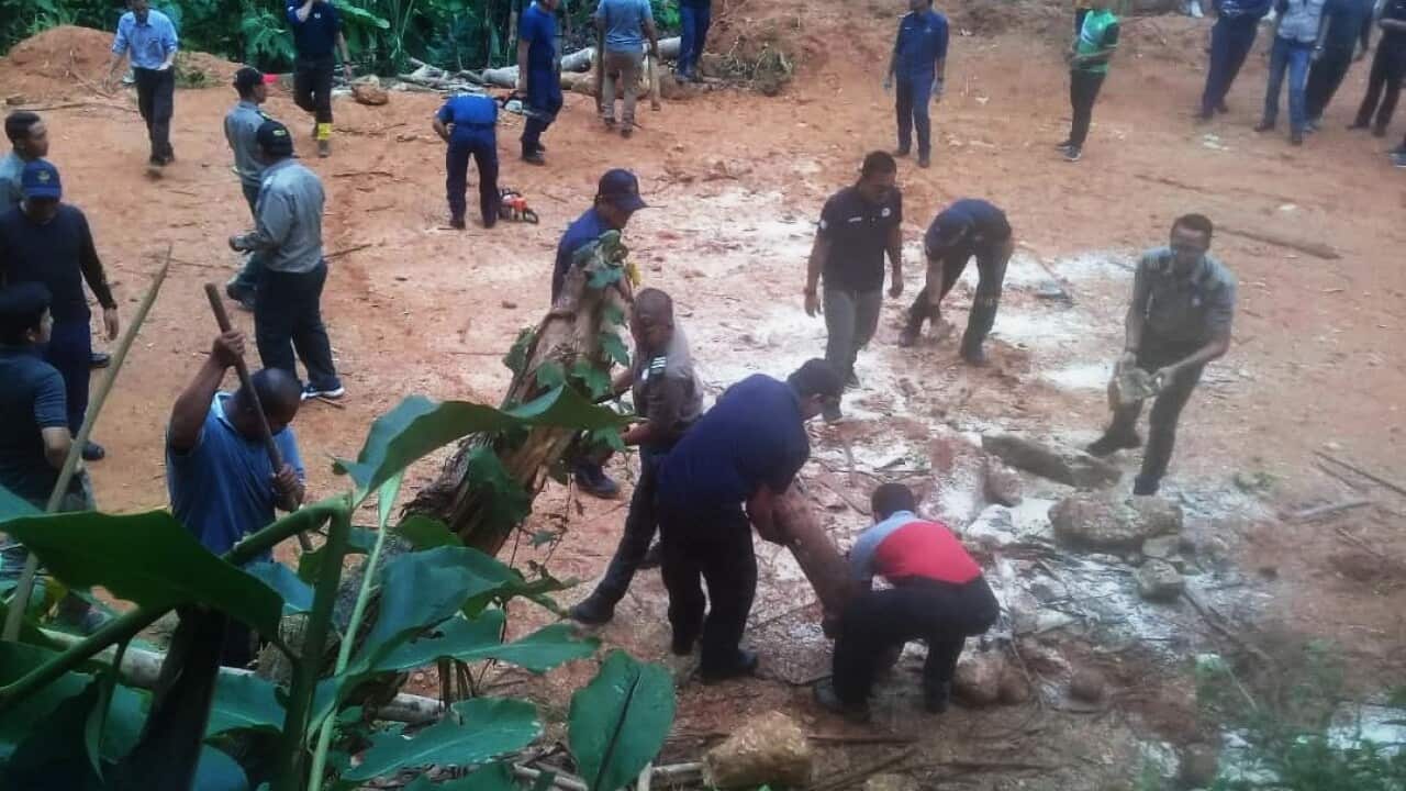 Perak state government officers demolish the Cunex village logging blockade